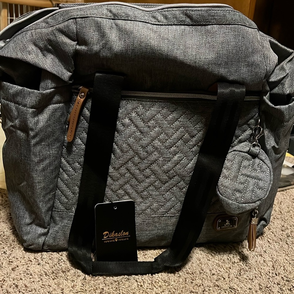 NWT Dikaslon gray Large Diaper Bag. Pacifier holder, changing pad, insulated hol